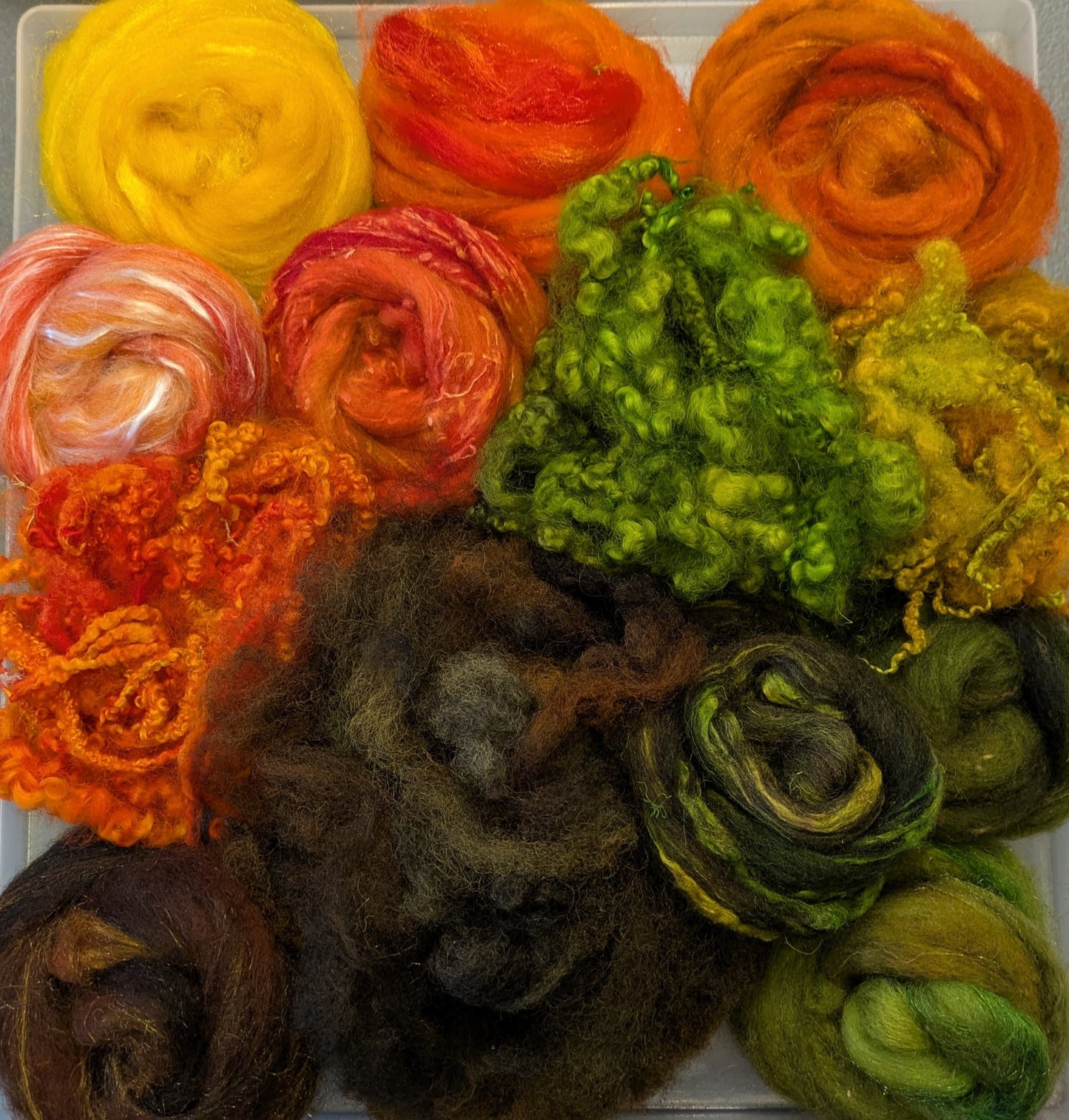 Hand dyed wool mix top with added texture and hand dyed fleece. Great to needle felt or wet felt 140g Autumn 2