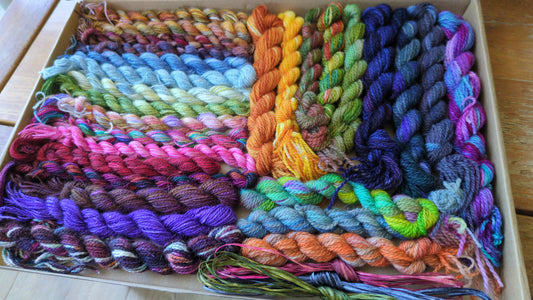 Assorted skeins of hand dyed silk threads,wool yarns, silk ribbons and raffia- a great mix of colours  - Box03