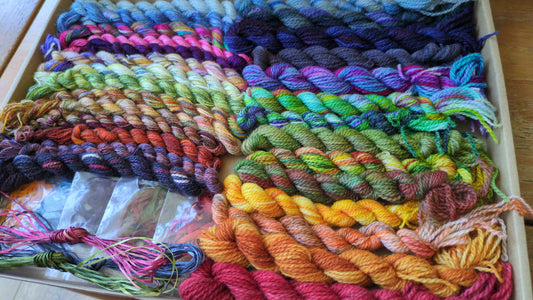 Assorted skeins of hand dyed silk threads,wool yarns, silk ribbons and raffia- a great mix of colours  - Box02
