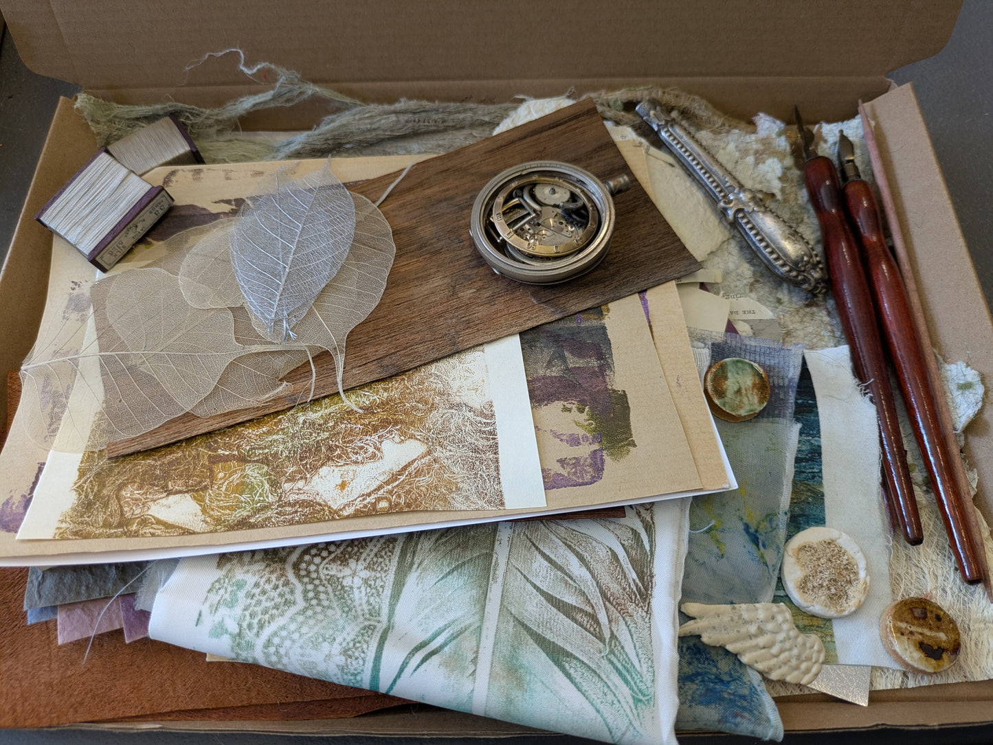 Studio destash, A4 box of Mixed media goodies hand made papers, dip pens, watch pieces, ephemera and more MMbox05